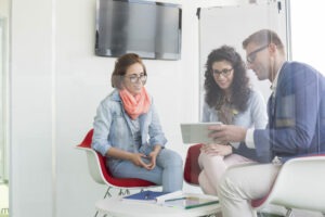 Business people discussing in meeting room.